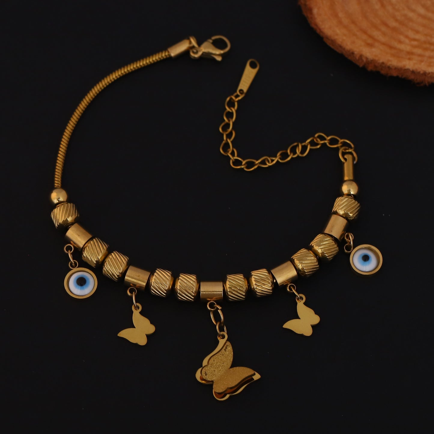 Gold Charm Bracelet with Evil Eye & Butterfly Motifs