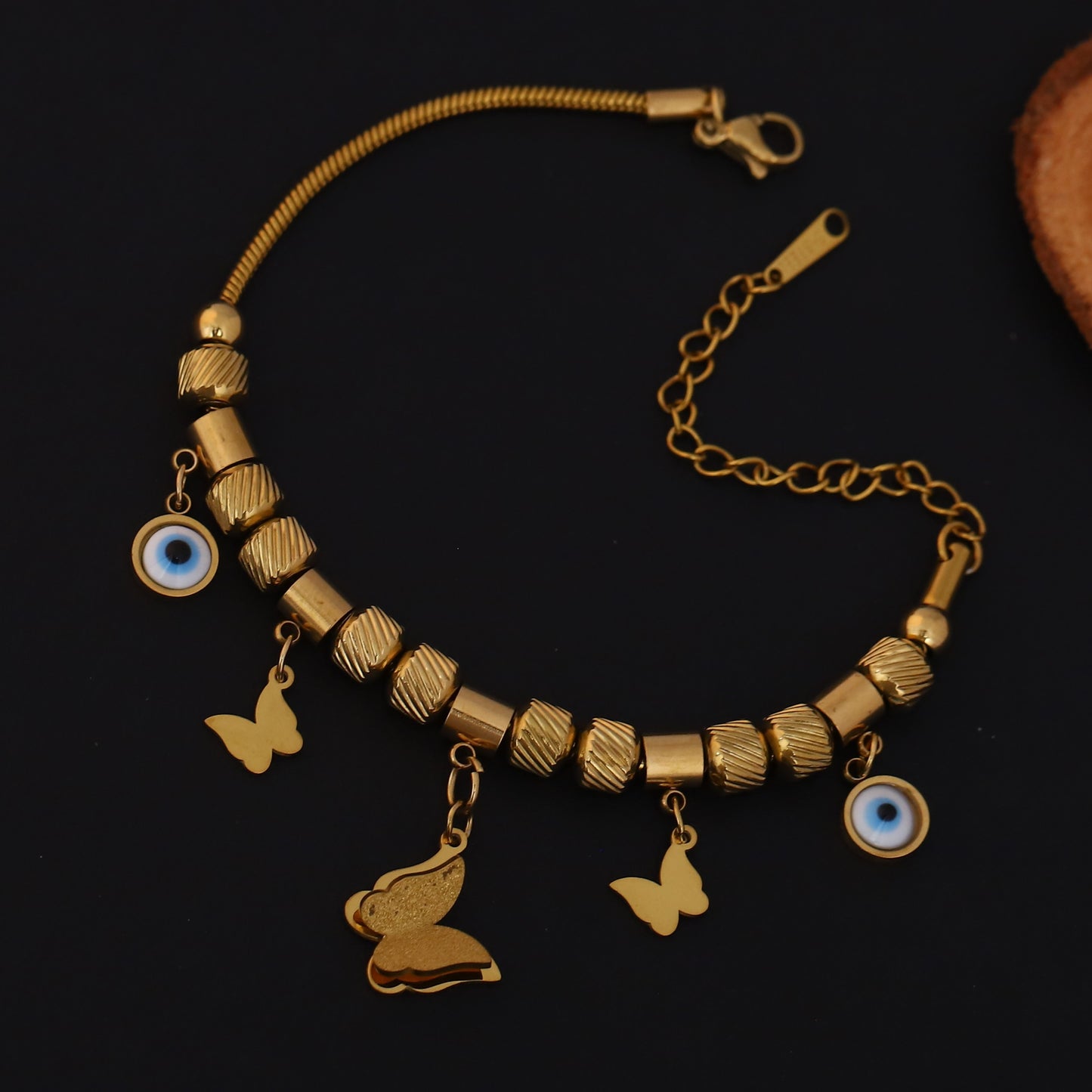 Gold Charm Bracelet with Evil Eye & Butterfly Motifs