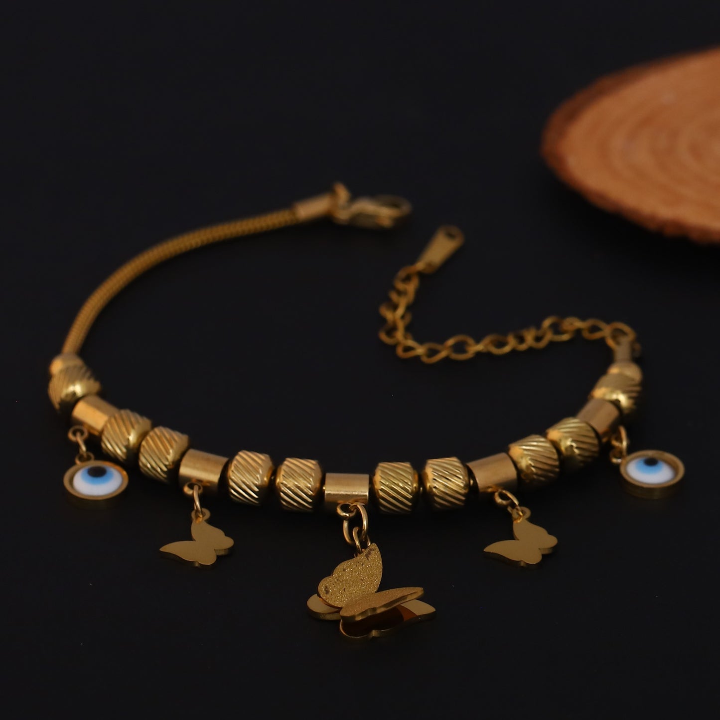 Gold Charm Bracelet with Evil Eye & Butterfly Motifs